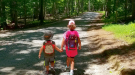 Two children walking in the woods. Photo courtesy of VA State Parks, Flickr. 